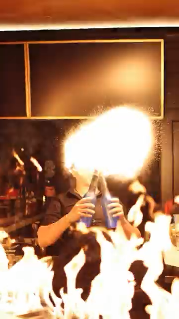 Bottle-service fire show during a live entertainment night at Fuego Steakhouse & Bar