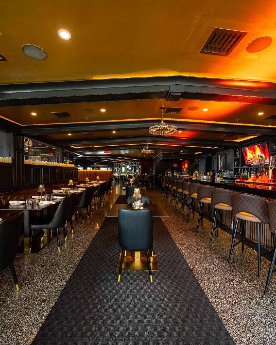 The dining room stretching toward the fireside bar